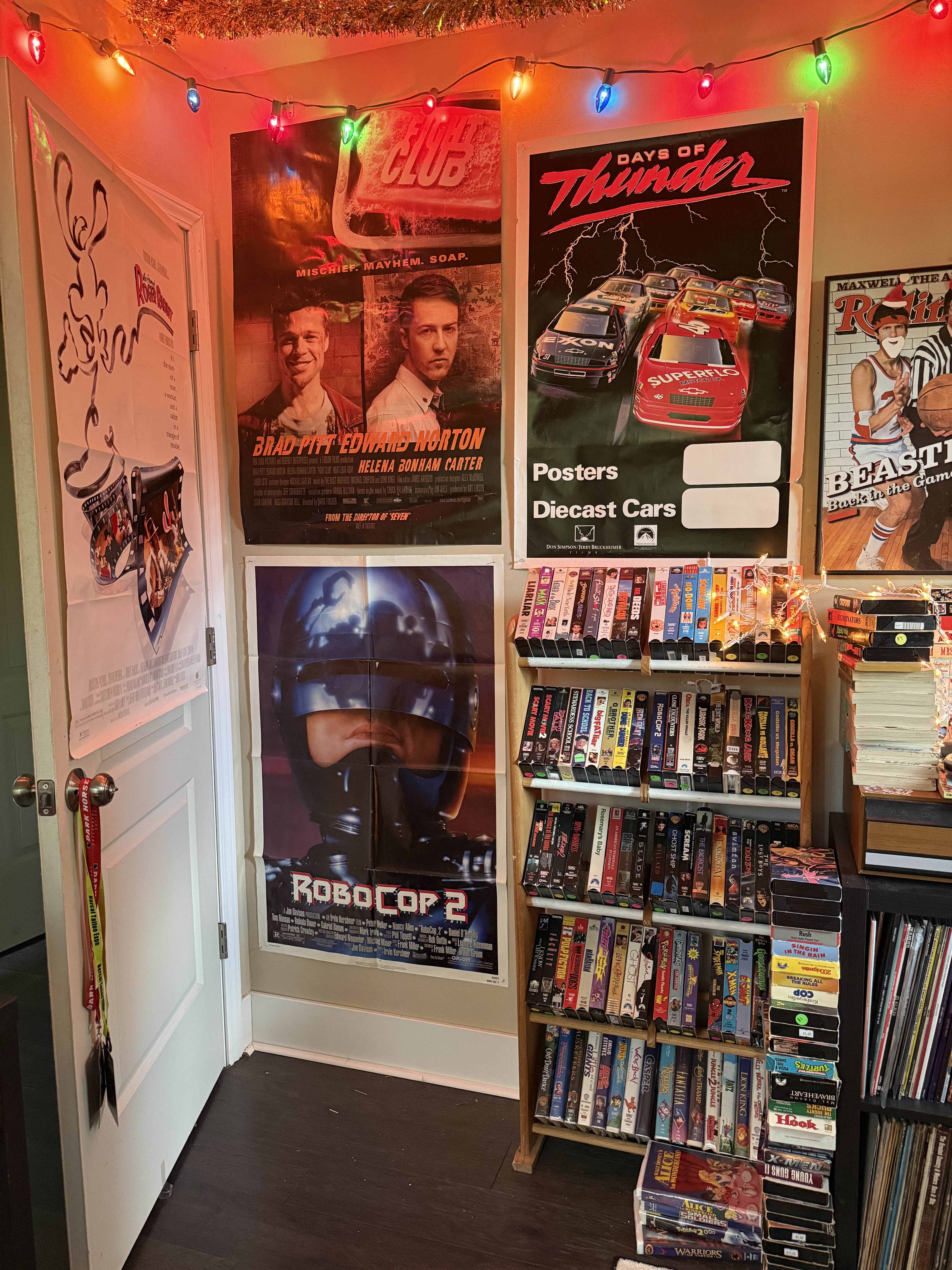 Fight Club and RoboCop 2 posters, VHS rack