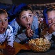 Kids wide-eyed watching movie