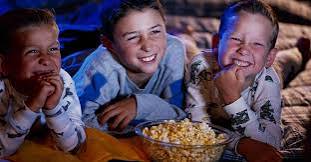 Kids in pajamas lit blue