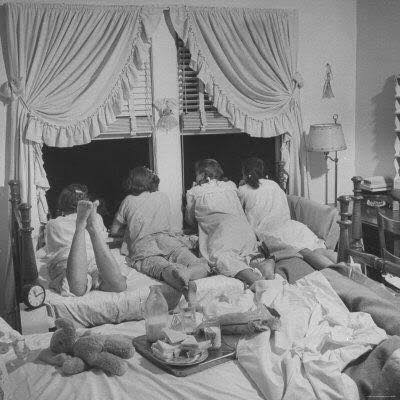Vintage sleepover, kneeling at window